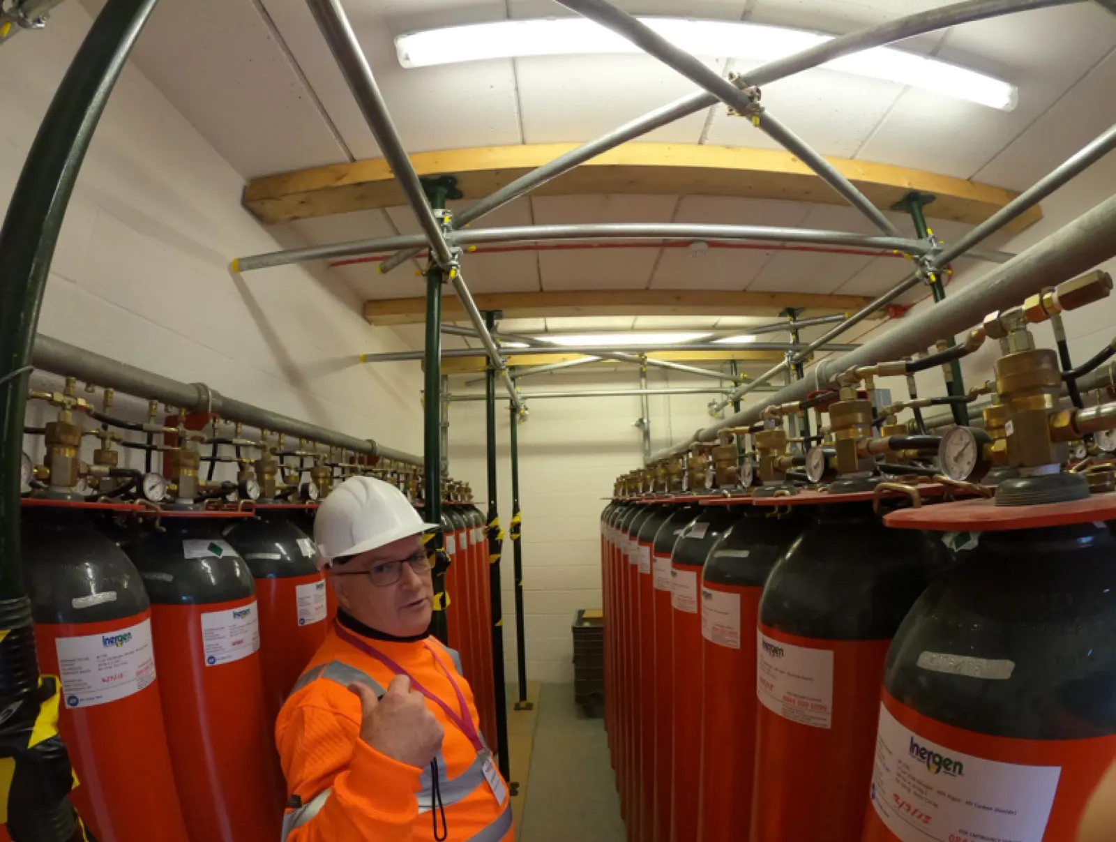A RAAC surveyor on site in a plant room